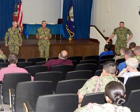 MERIDIAN, Miss. (Aug. 11, 2022) Rear Adm. Pete Garvin, commander, Naval Education and Training Command (NETC), center left, and NETC’s Force Master Chief Matt Harris, left, speak with Naval Technical Training Center (NTTC) Meridian staff during an all-hands call at Naval Air Station Meridian, Mississippi, Aug. 11, 2022. NTTC Meridian provides entry-level “A” school training to students in administration and supply ratings, as well as extensive training to top-performing naval personnel in the yeoman rating to qualify as flag writers. (U.S. Navy photo by Penny Randall)