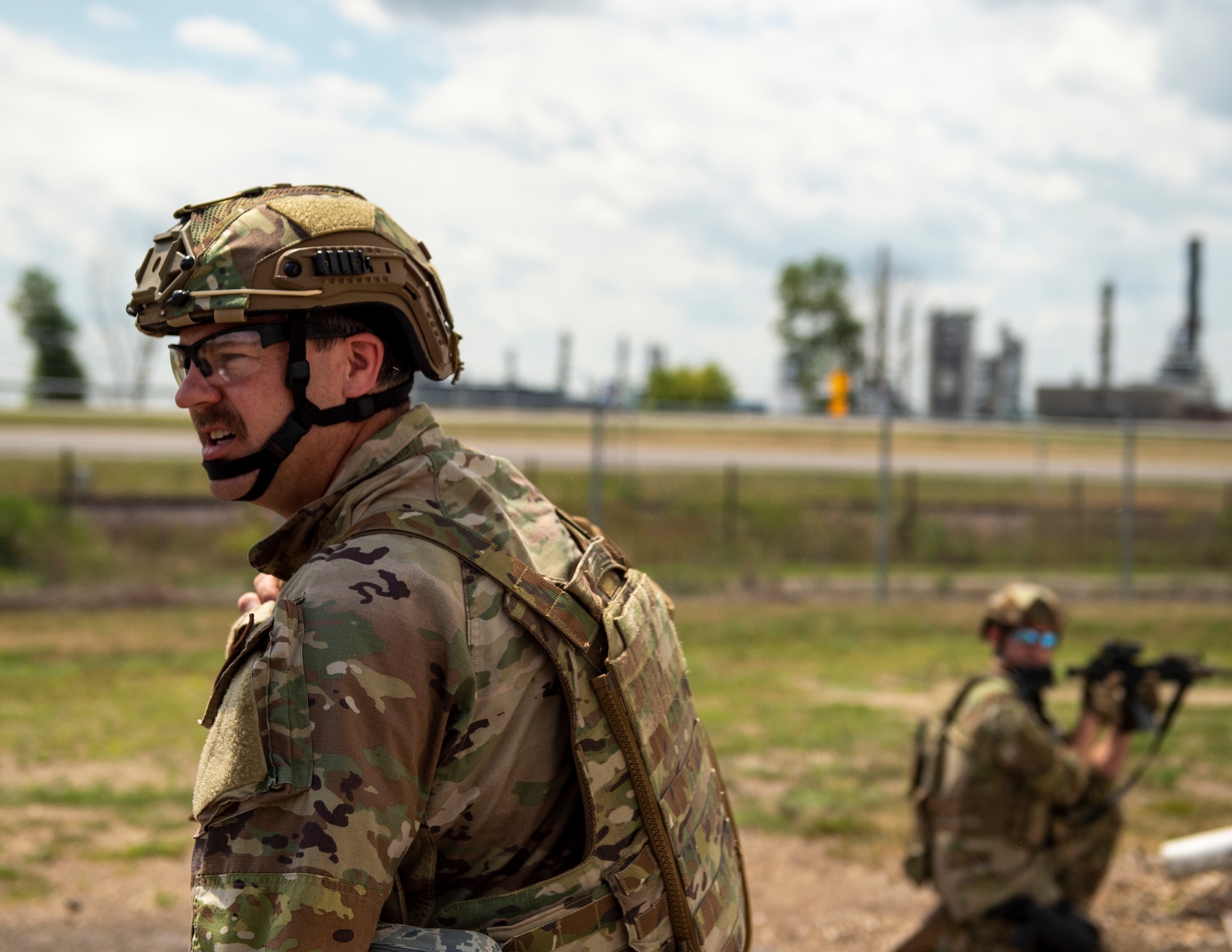 U.S. Air Force Tech. Sgt. Jeff Allen, left, 146th Contingency Response Flight, California Air National Guard, provides security for medical teams in Rosemount, Minn., July 27, 2022.