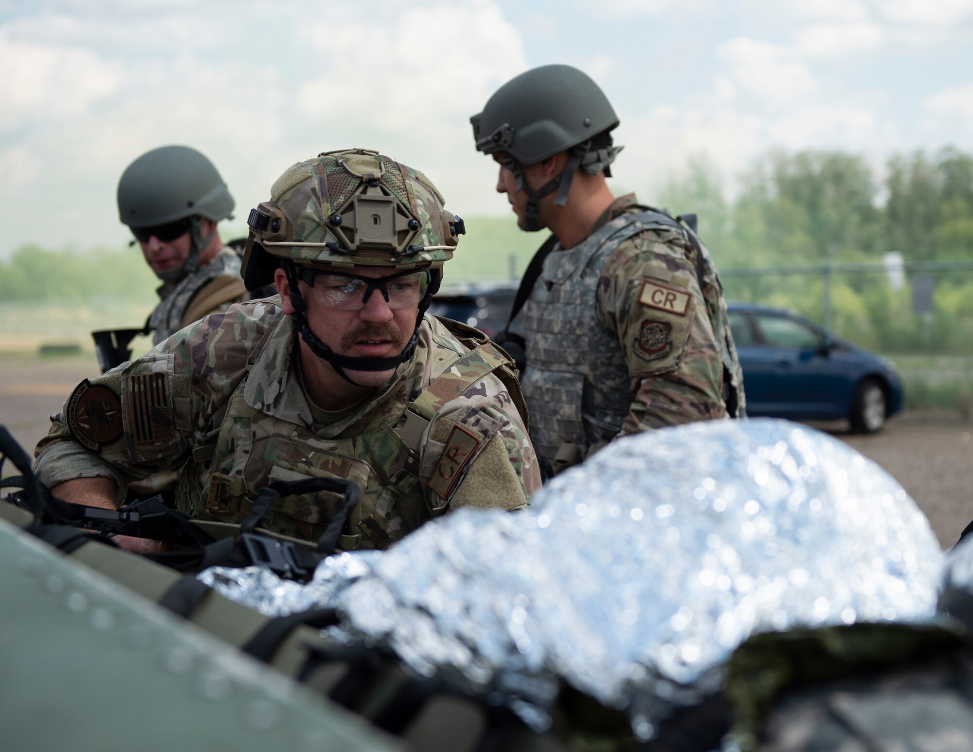 U.S. Air Force Tech. Sgt. Jeff Allen, center, 146th Contingency Response Flight, California Air National Guard, prepares to close the tailgate of a HUMVEE in Rosemount, Minn., July 27, 2022.