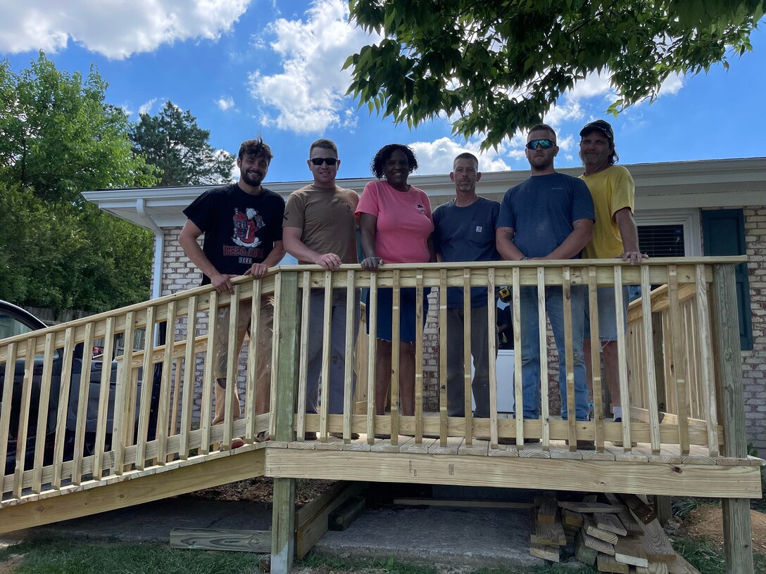 Several Kentucky National Guard Soldiers, as well as, a few civilians, donated their time to help build a needed ramp so Spc. Akir Jackson could access his home with his new electrical wheelchair.