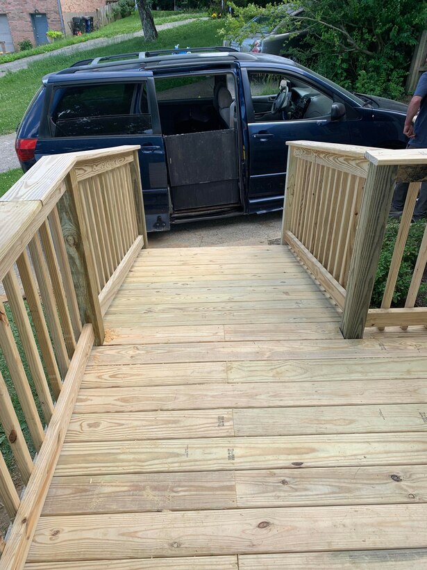 Several Kentucky National Guard Soldiers, as well as, a few civilians, donated their time to help build a needed ramp so Spc. Akir Jackson could access his home with his new electrical wheelchair.