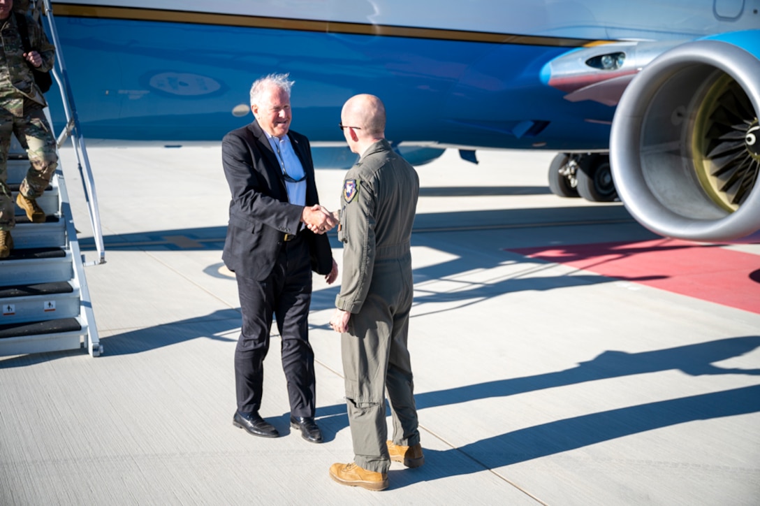 Secretary of the Air Force, Mr. Frank Kendall, shakes hands with Brig. Gen. Matthew Higer, 412th Test Wing Commander, during his visit to see the latest in innovation. (Air Force photo by Adam Bowles)