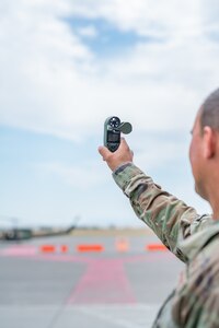 Master Sgt. Matthew Bolin, 341st Operations Support Squadron weather flight chief, demonstrates the use of a hand-held weather observing device Aug. 10, 2022, at Malmstrom Air Force Base, Mont.