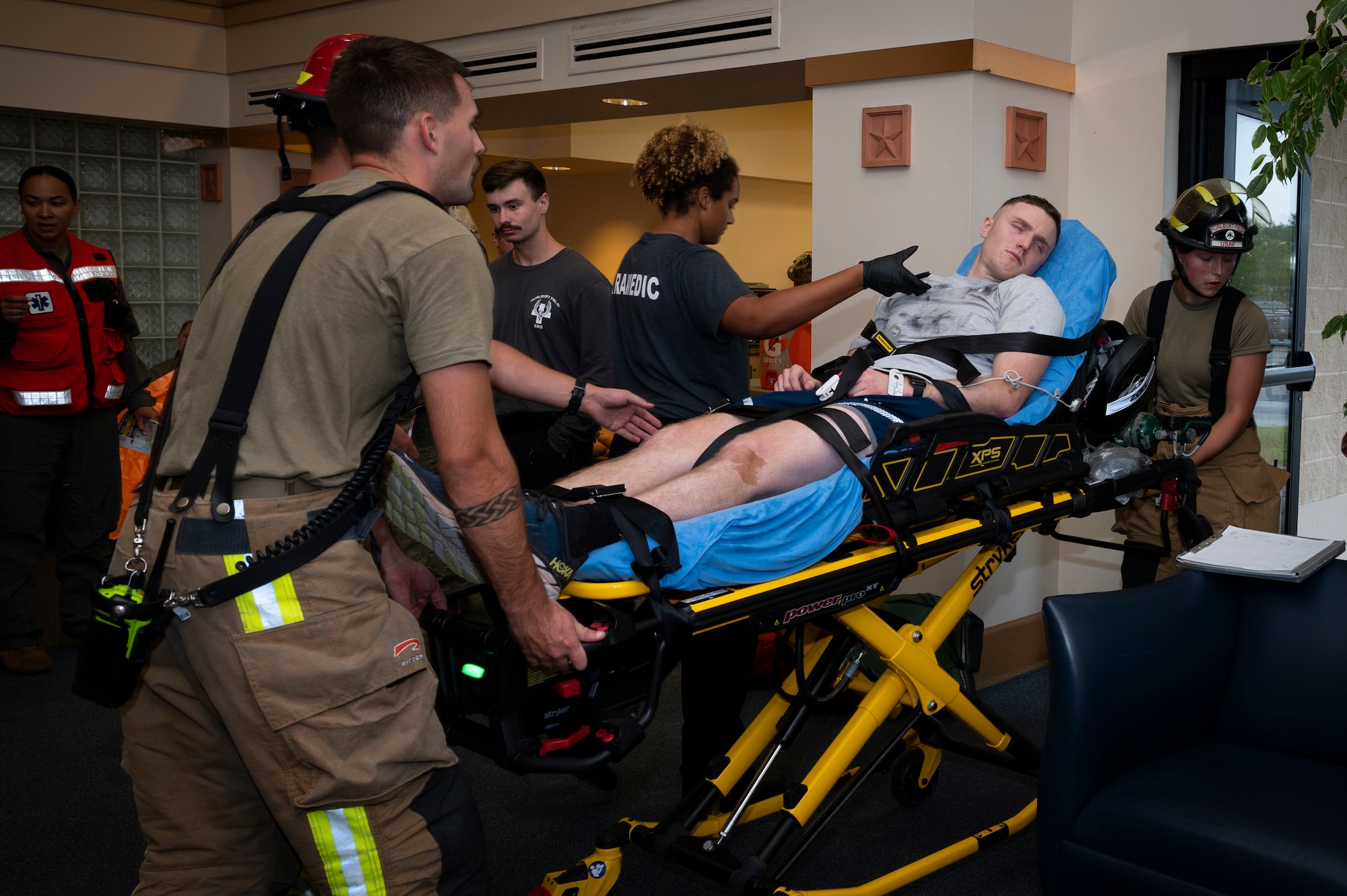 U.S. Air Force firefighters and paramedics remove a patient from the scene during a Massive Accident Response Exercise Aug. 22, 2022, at Hurlburt Field, Florida.
