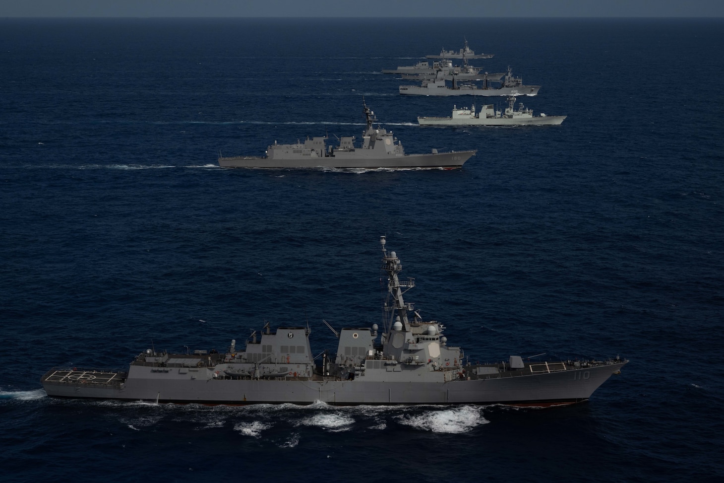 Multinational ships sail in formation during Pacific Dragon 2022, Aug. 12. Hosted by U.S. 3rd Fleet, Pacific Dragon is a biennial exercise in the in the Hawaiian Islands Operating Area that enhances participating forces' interoperability to track and report on air and missile defense targets