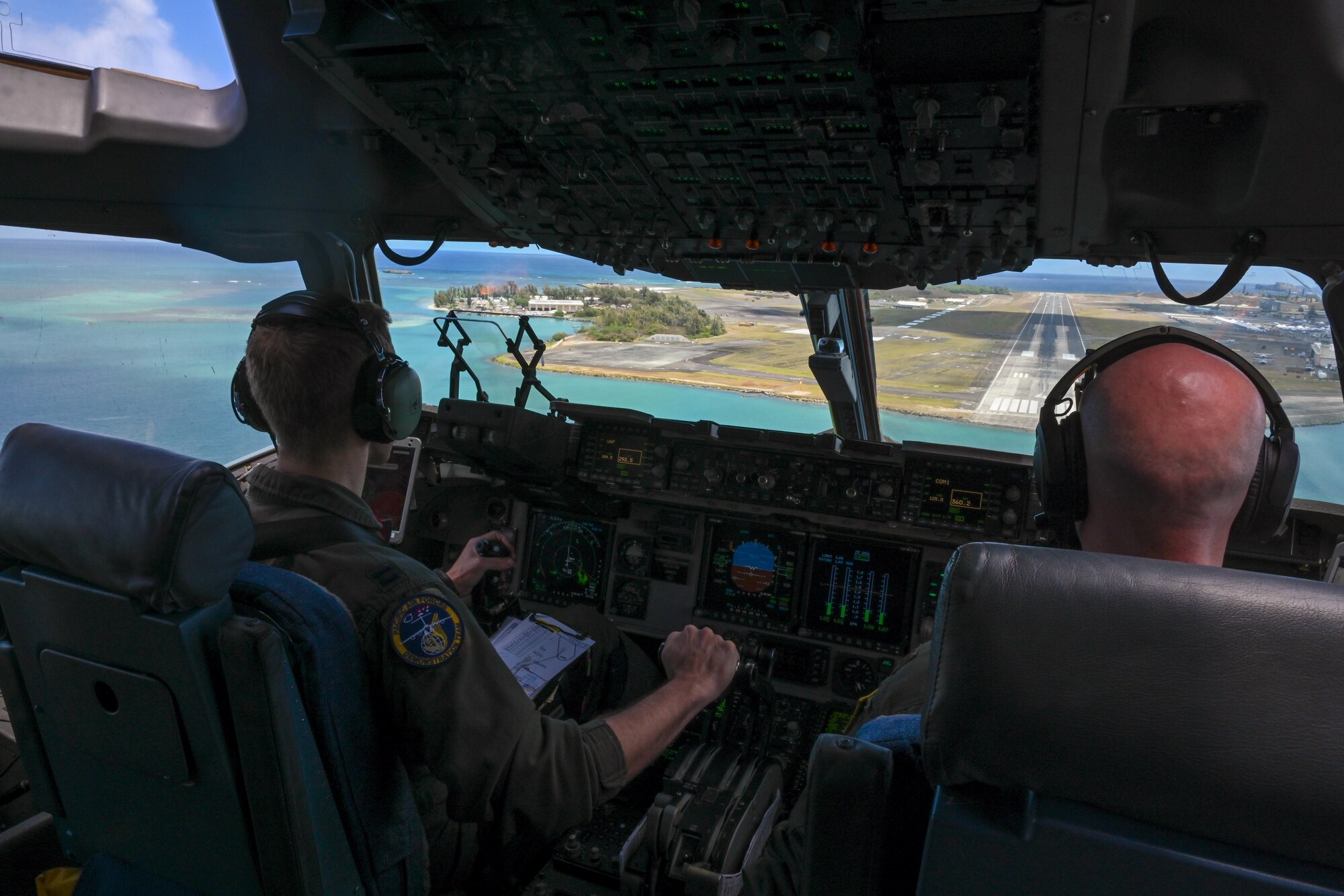 Capt. Christopher Abrahamsen and Maj. Jeremy Smith, 535th Airlift Squadron pilots, land during the Kaneohe Bay Air Show at Marine Corps Base Hawaii, Hawaii, Aug. 12, 2022. The U.S. Pacific Air Forces C-17 Globemaster III demo team showcased the capabilities of the aircraft by executing high-angle take-offs, high-speed passes, low-speed configured passes, 360-degree maneuvers and an assault landing. (U.S. Air Force photo by Senior Airman Makensie Cooper)