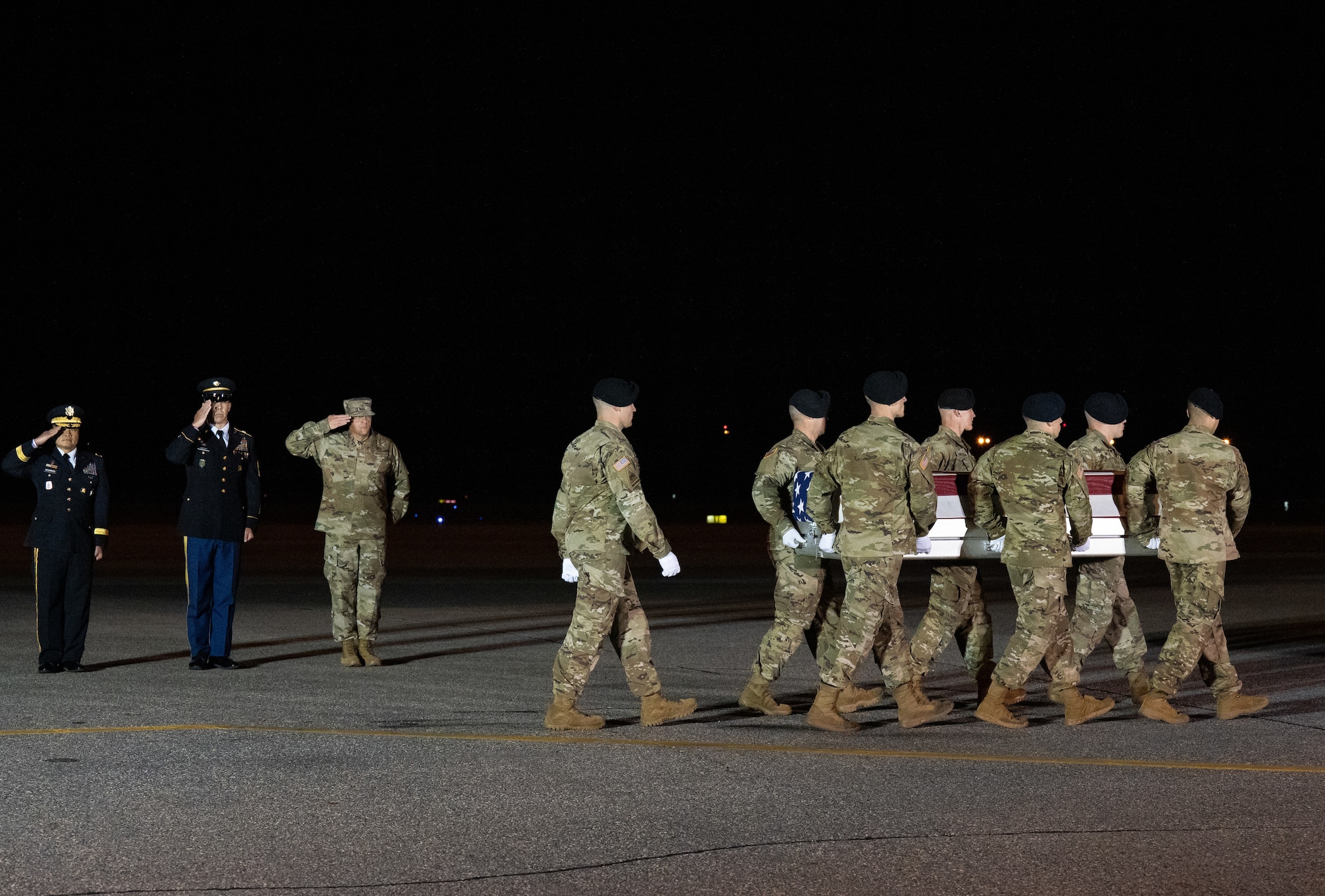 A U.S. Army carry team transfers the remains of Spc. Denisha M. Montgomery of Elizabethtown, Kentucky, Aug. 15, 2022 at Dover Air Force Base, Delaware. Montgomery was assigned to the 139th Military Police Company, Fort Stewart, Georgia. (U.S. Air Force photo by Jason Minto)