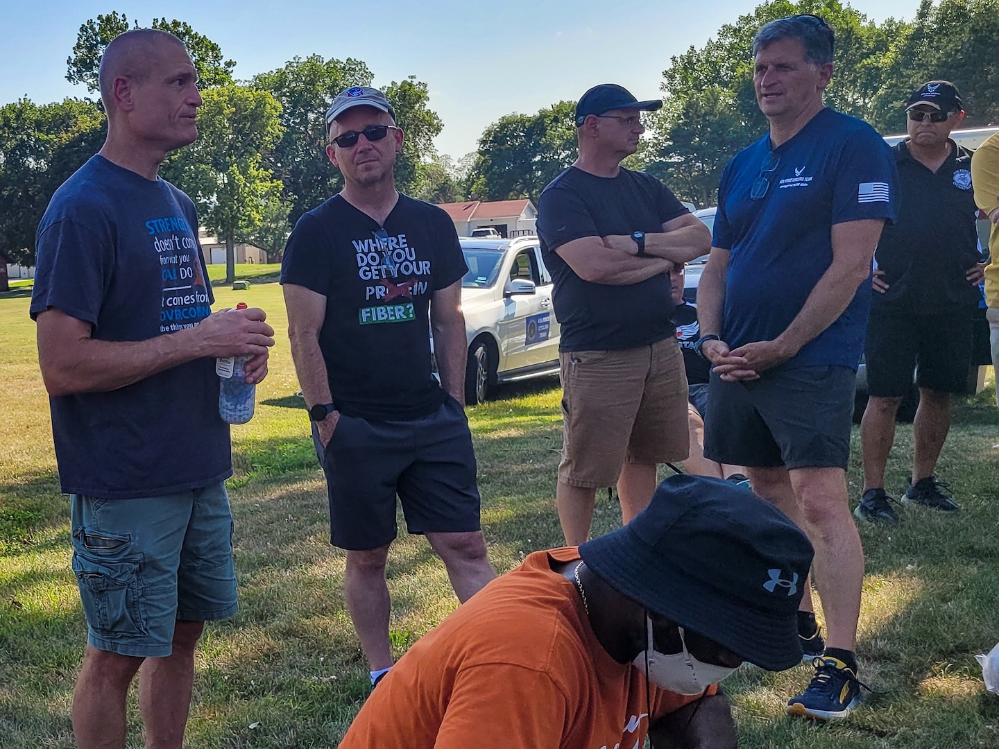 Group of cyclists listen as one is speaking