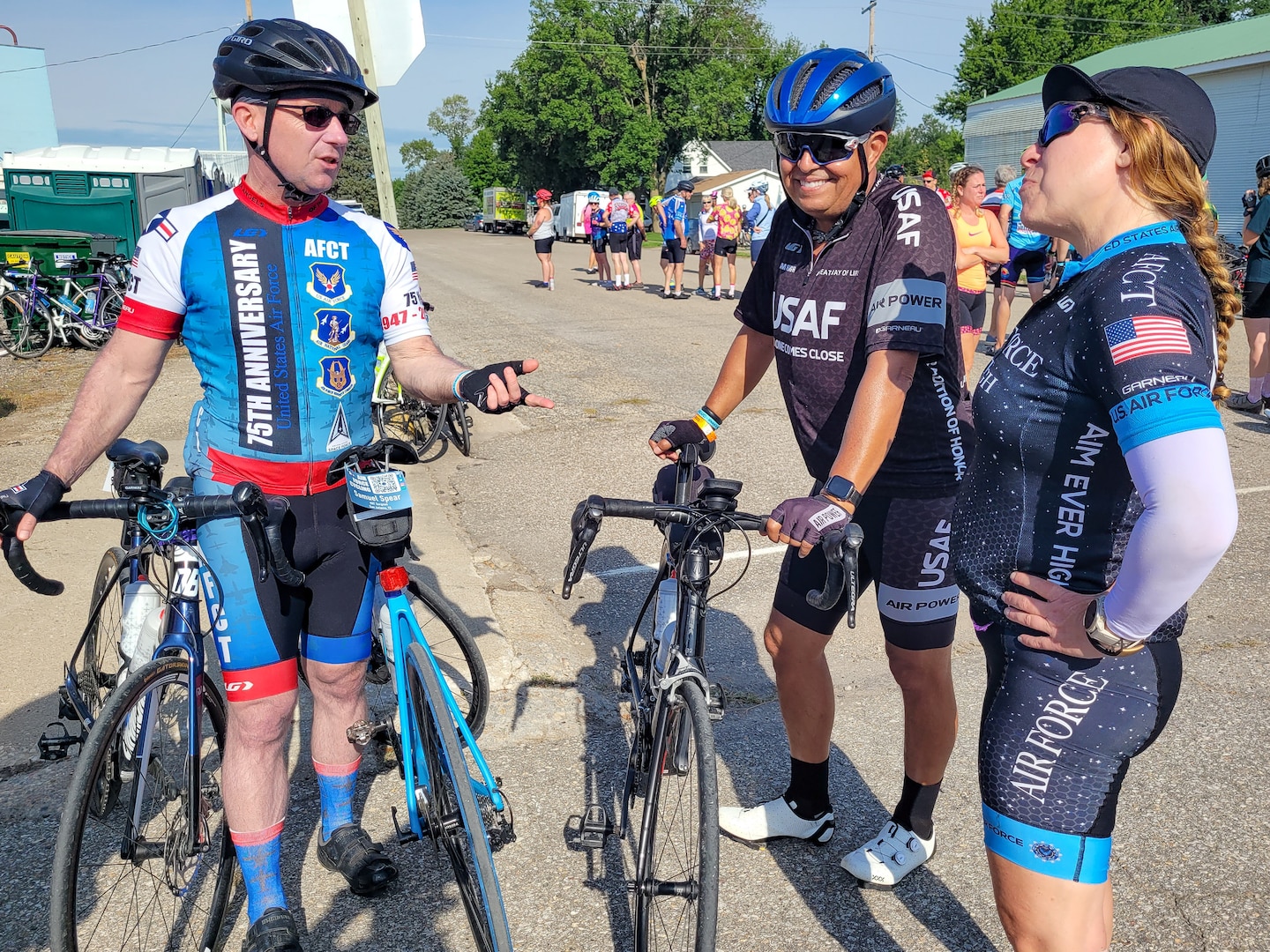 Three cyclist talking while standing