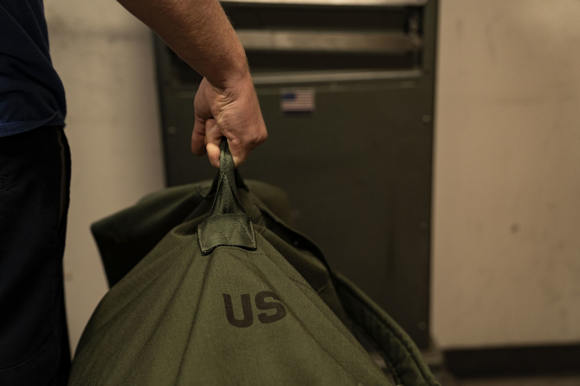 Daniel Townsend, Ace Moving and Storage contracted mover, arranges luggage at the Levitow Training Support Facility as part of the Baggage Turn-In program at Keesler Air Force Base, Mississippi, Aug. 15, 2022. The BTI program was designed to save technical training students class time before their first permanent change of station by giving them the option to drop their bags with a moving service. (U.S Air Force photo by Airman 1st Class Trenten Walters)