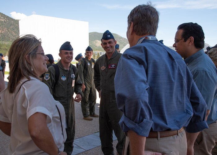 Col.Rubio and Ashton, both in uniform, talk to three others