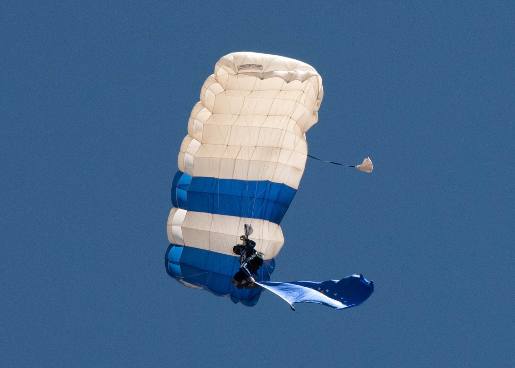 A parachutist descends
