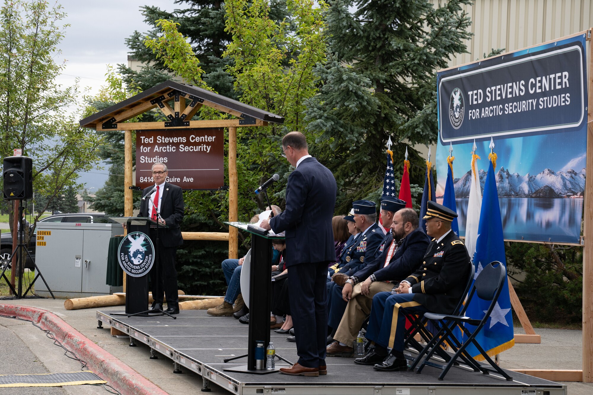 A photo of visitors speaking at an opening ceremony