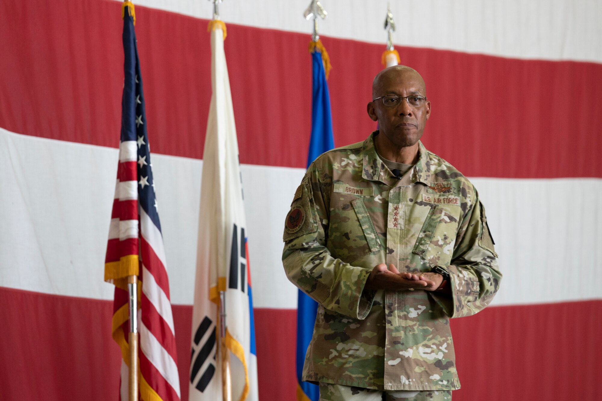 Air Force Chief of Staff Gen. CQ Brown, Jr., listens to an Airmans question during the Q&A portion of an all-call at Osan Air Base, Republic of Korea, Aug. 12, 2022.
