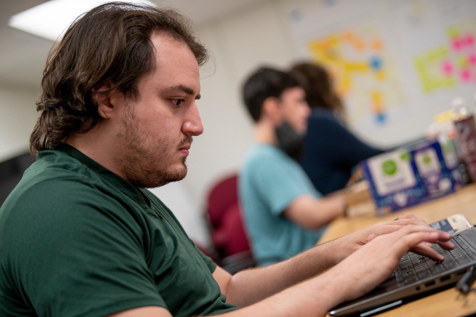 Man works on computer