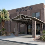 photo of US military brick building with words ShOC-N on the building