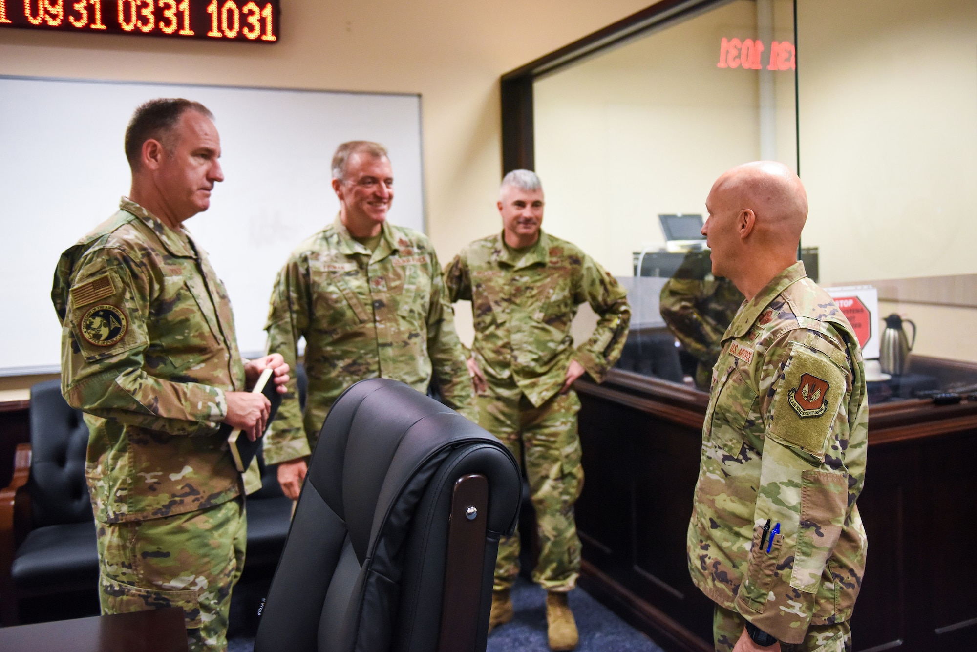 Brig. Gen. Patrick Ryder (left), Office of the Secretary of the Air Force director of public affairs, and Col. Robert Firman (left center), U.S. Air Forces in Europe-Air Forces Africa director of PA, meet with Col. Kevin McCaskey (right center), 39th Air Base Wing vice commander, and Col. Calvin Powell, 39th ABW commander, during a visit at Incirlik Air Base, Turkey, Aug. 4, 2022.