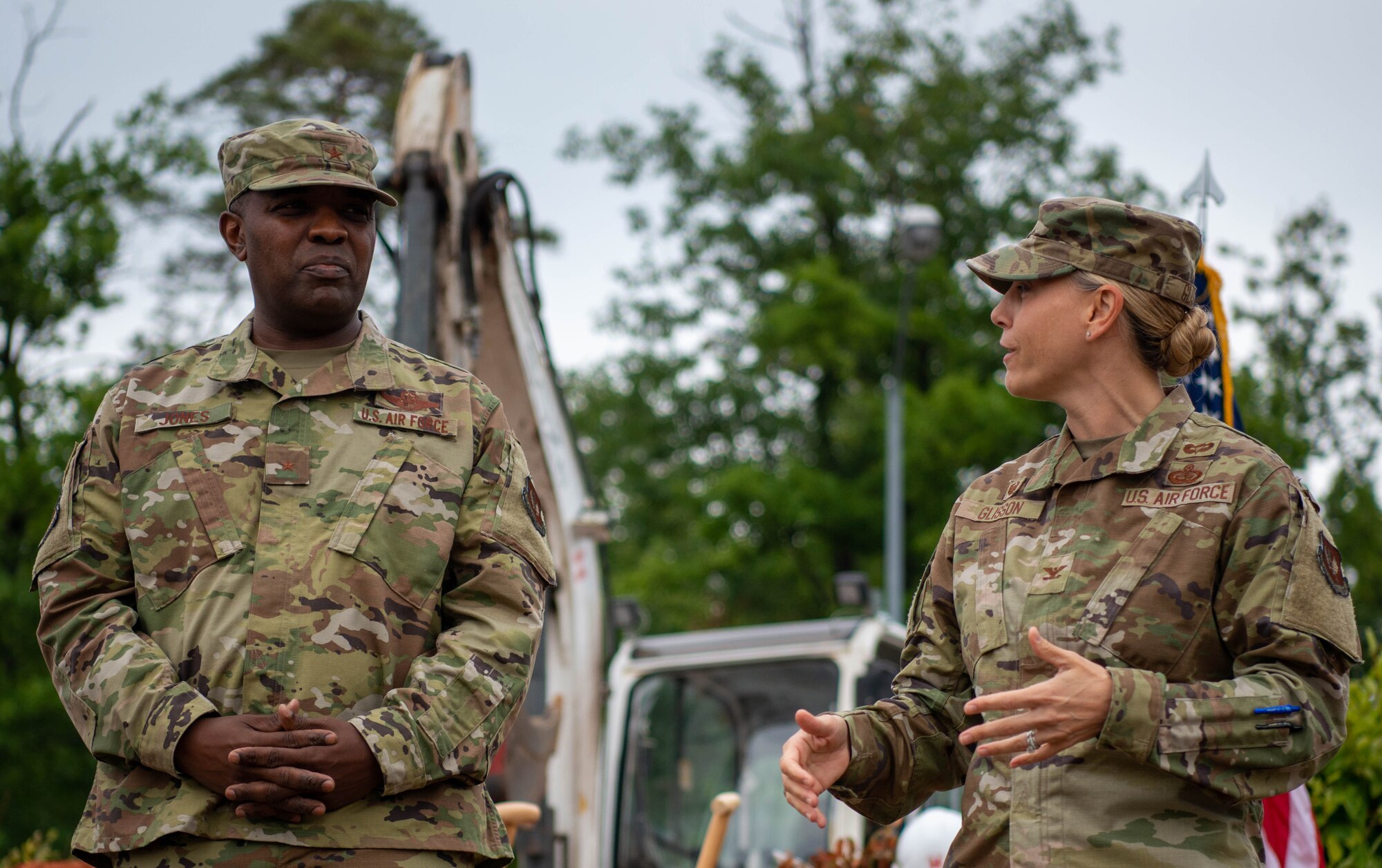 U.S. Air Force Col. Amy Glisson, 86th Mission Support Group commander, right, and Brig. Gen. Otis C. Jones, 86th Airlift Wing commander, left, speak about the new Gateway to Europe traffic circle monument at Ramstein Air Base, Germany, Aug. 15, 2022.
