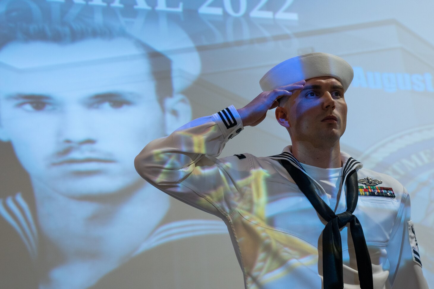 220812-N-IT566-0039 FORT SAM HOUSTON, Texas (Aug. 12, 2022) Hospital Corpsman 2nd Class John Gorman, assigned to Navy Medicine Training Support Center, salutes during the playing of taps after conducting the Final Roll Call, which honors fallen Sailors, during a ceremony commemorating the 70th anniversary of the death of Hospitalman John E. Kilmer. Kilmer was killed, during the atta