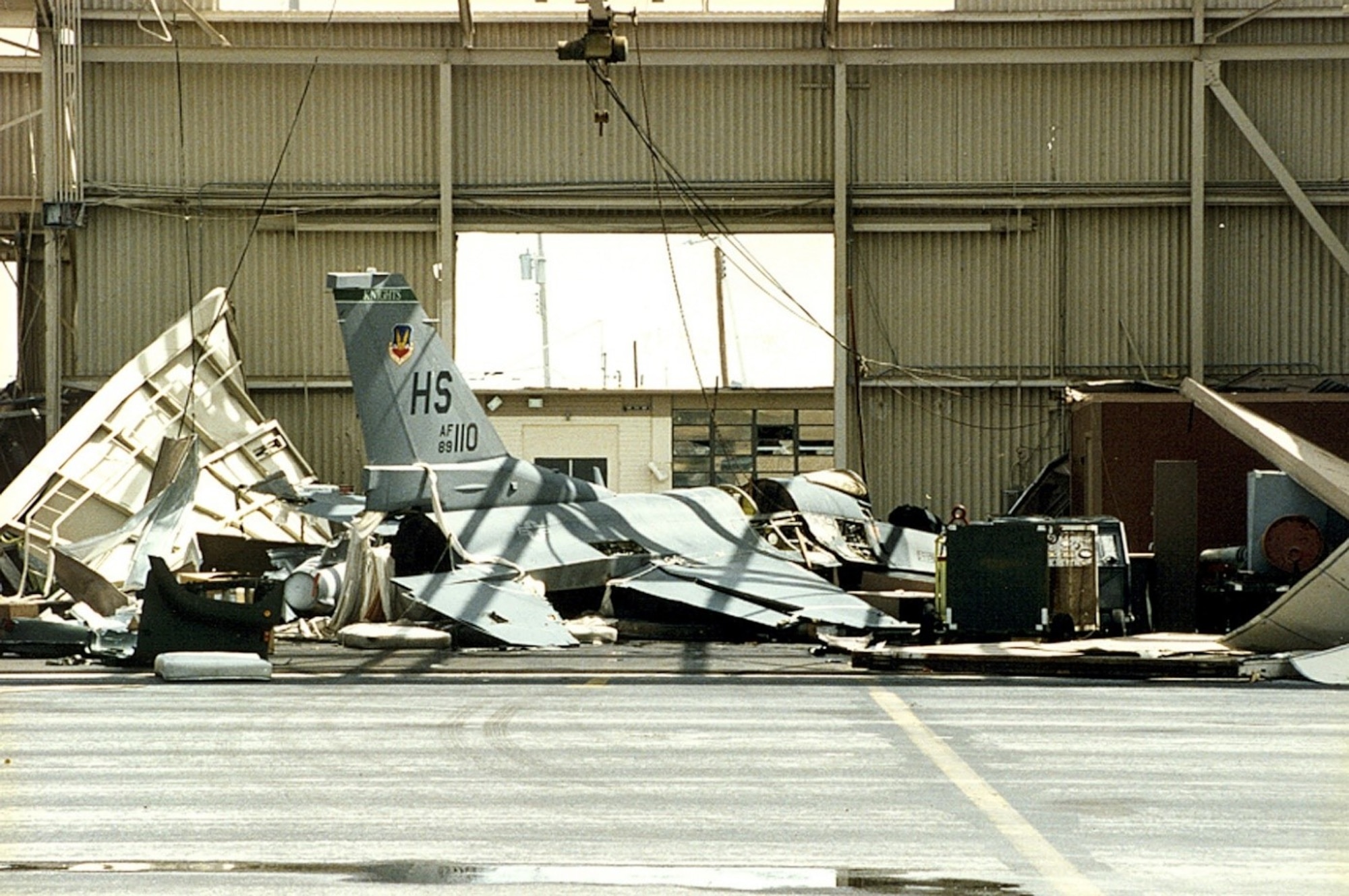 Photo of one of the F-16 Fighting Falcons left behind in a demolished hangar.