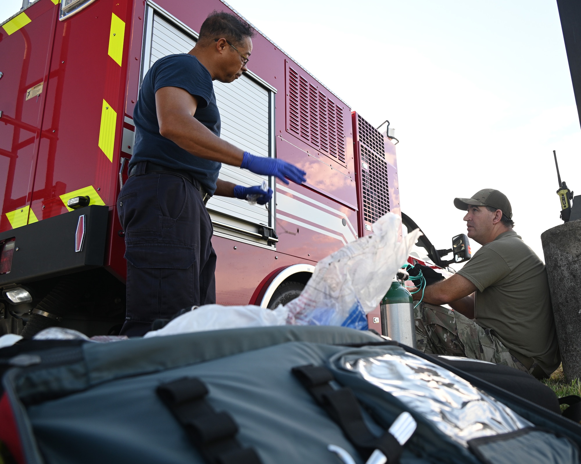 U.S. Air Force Staff Sgt. Jason Zabetakis, a fuels craftsman assigned to the 175th Mission Support Group, receives medical care from Sterling Johnson, a firefighter 2 assigned to the 175th Wing Fire Department, after a simulated fuel spill during a Mission Assurance Exercise at Warfield Air National Guard Base at Martin State Airport, Middle River, Maryland, August 12, 2022.