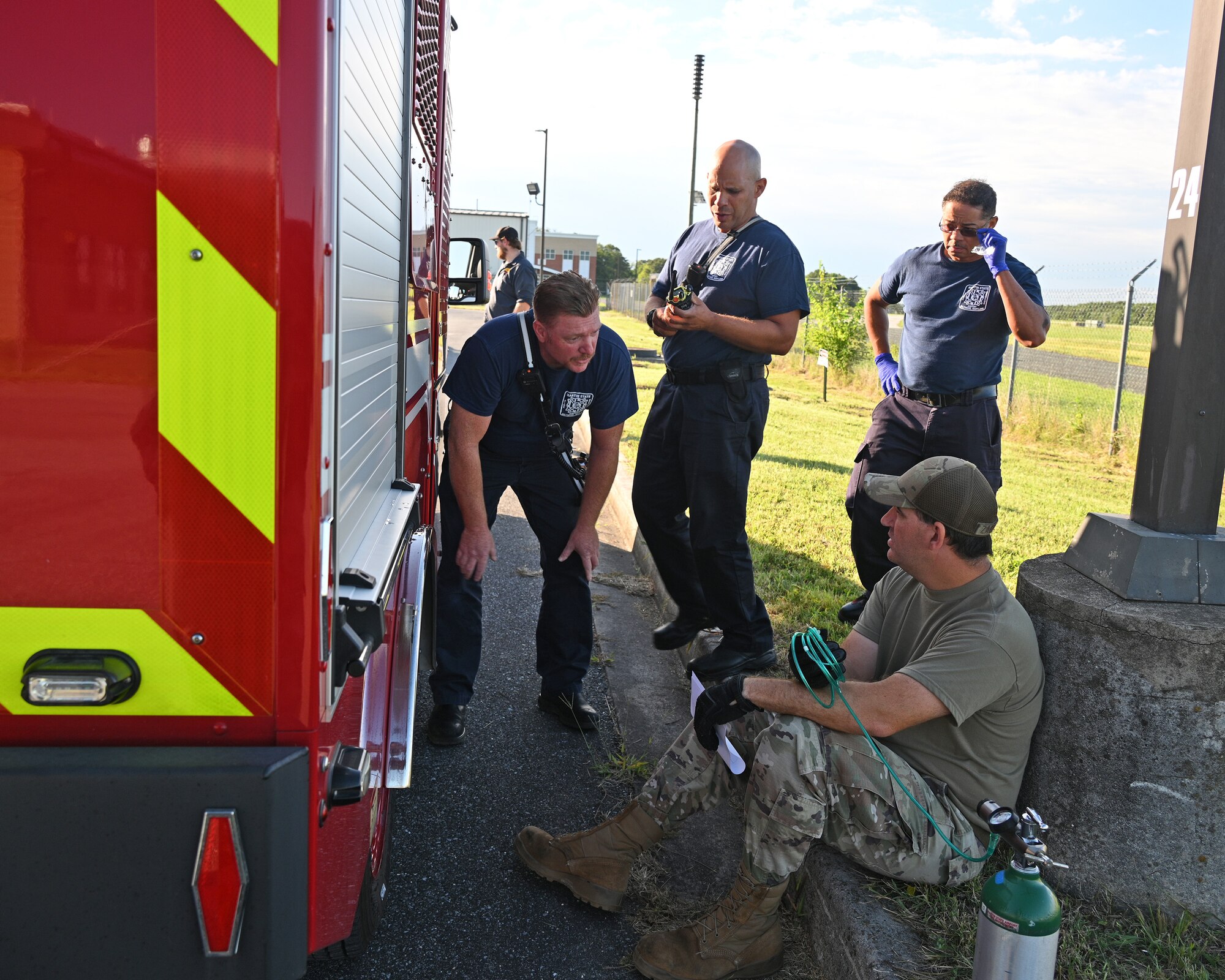 U.S. Air Force Staff Sgt. Jason Zabetakis, a fuels craftsman assigned to the 175th Mission Support Group, receives medical care from the 175th Wing Fire Department after a simulated fuel spill during a Mission Assurance Exercise at Warfield Air National Guard Base at Martin State Airport, Middle River, Maryland, August 12, 2022.