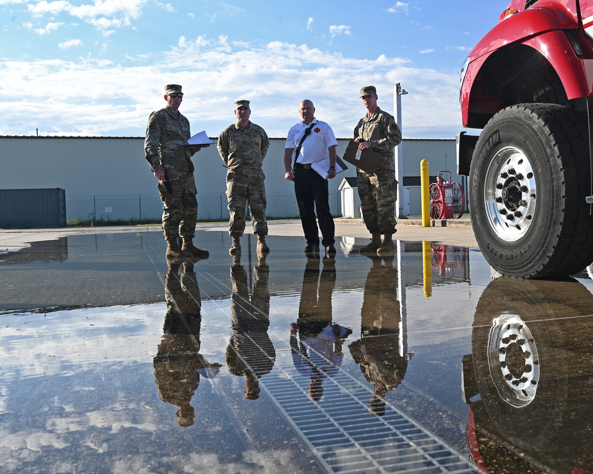 Members of the Mission Assurance Exercise inspection team observe a simulated fuel spill during a Mission Assurance Exercise at Warfield Air National Guard Base at Martin State Airport, Middle River, Maryland, August 12, 2022.