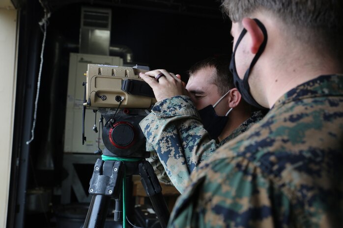 Marines peer through a prototype version of the Next-Generation Handheld Targeting System, March 2021 at U.S. Army Garrison Fort A.P. Hill, Virginia.