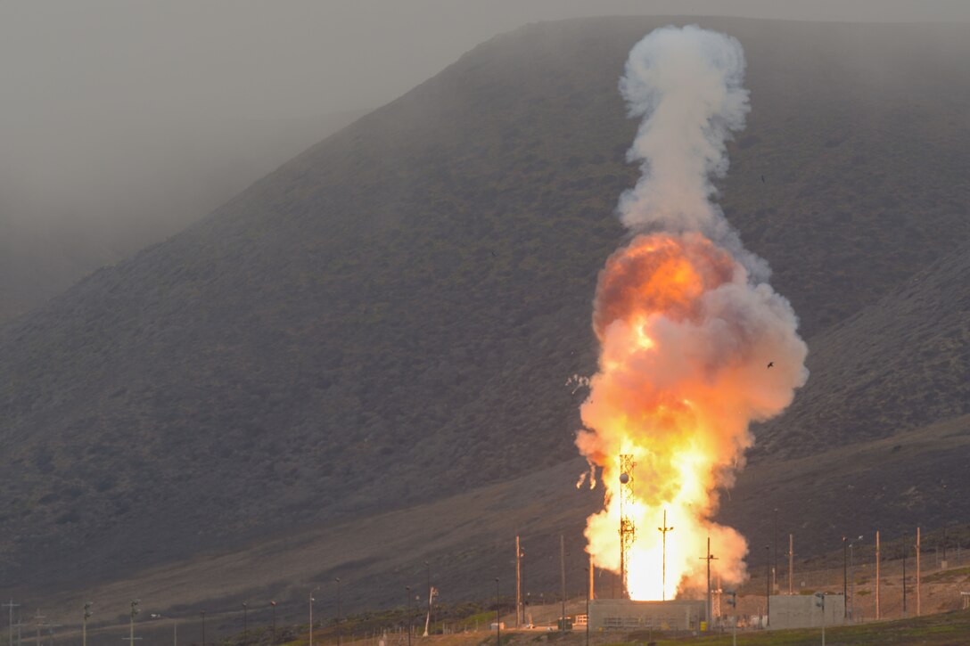 A rocket launches from the ground.