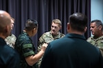 Maj. Joel Johnson, Bilateral Affairs Officer in the Kingdom of Thailand talks with one of his Royal Thai Army counterparts during a State Partnership Program Exchange on July 31, 2022.