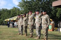 The official party at the U. S. Army Civil Affairs and Psychological Operations Command (AIRBORNE) joint Change of Command, Change of Responsibility, Retirement Ceremony salute during the presentation of the colors on the main parade field, Ft. Bragg, NC., August 13, 2022. (U.S. Army Reserve photo by Pfc. Anthony Till)