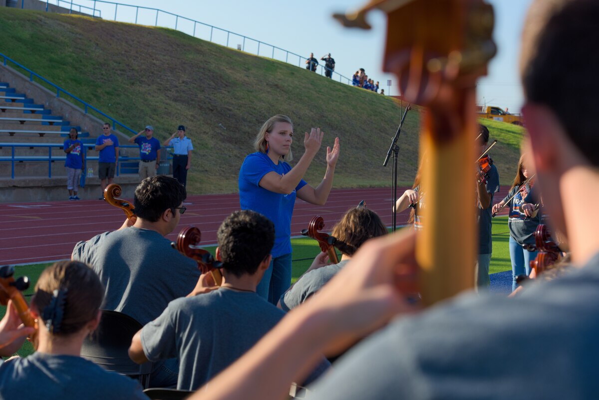 Members of the San Angelo Independent School District combined band play the national anthem at the SAISD convocation, San Angelo Stadium, Texas, August 10, 2022. The combined band featured faculty and students from multiple schools across the school district. (U.S. Air Force photo by Senior Airman Michael Bowman)