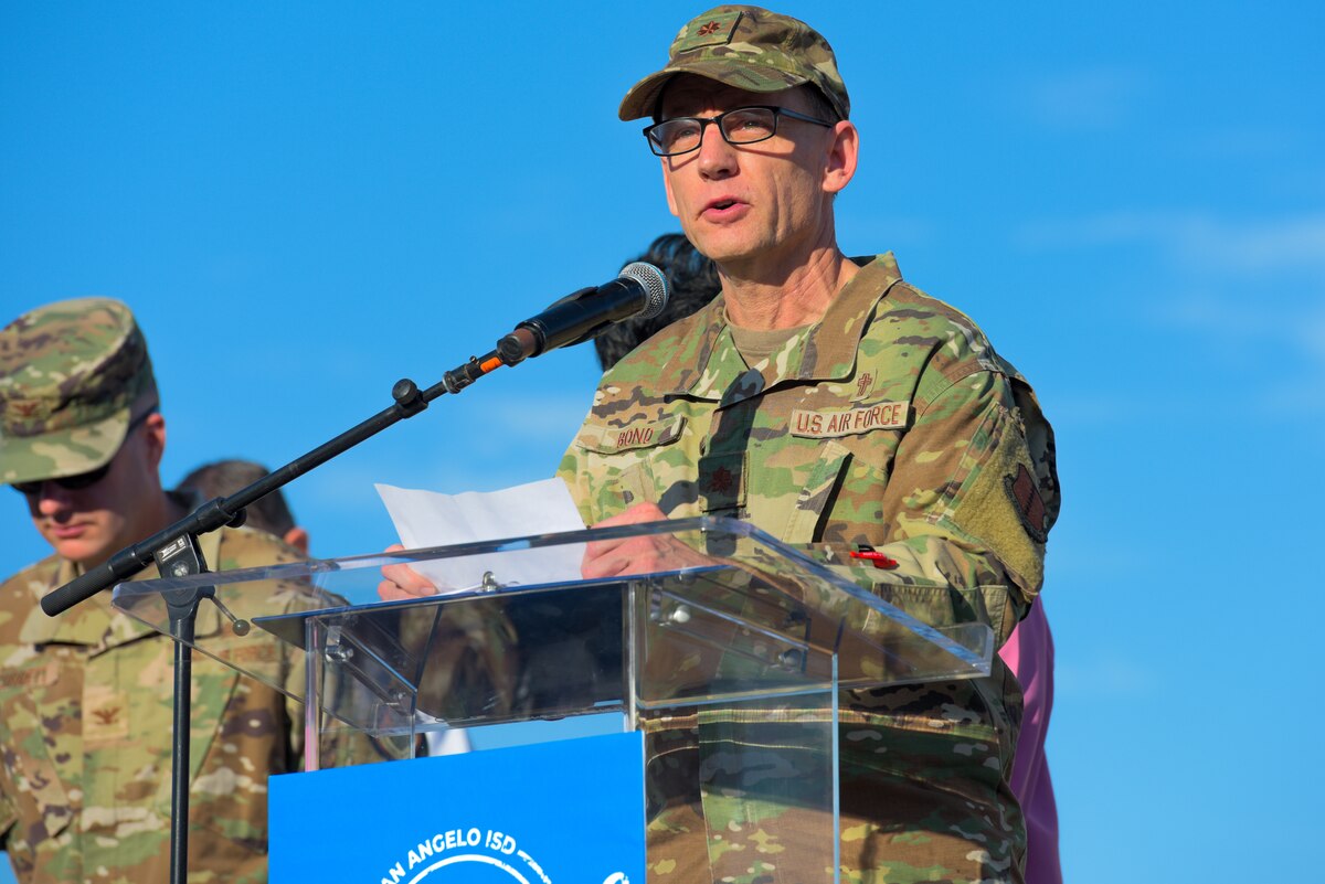 U.S. Air Force Maj. James Bond, 17th Training Wing chaplain, delivers an invocation at the San Angelo Independent School District convocation, San Angelo Stadium, Texas, August 10, 2022. San Angelo and Goodfellow Air Force Base maintain the most community partnerships of any base within Air Education and Training Command. (U.S. Air Force photo by Senior Airman Michael Bowman)