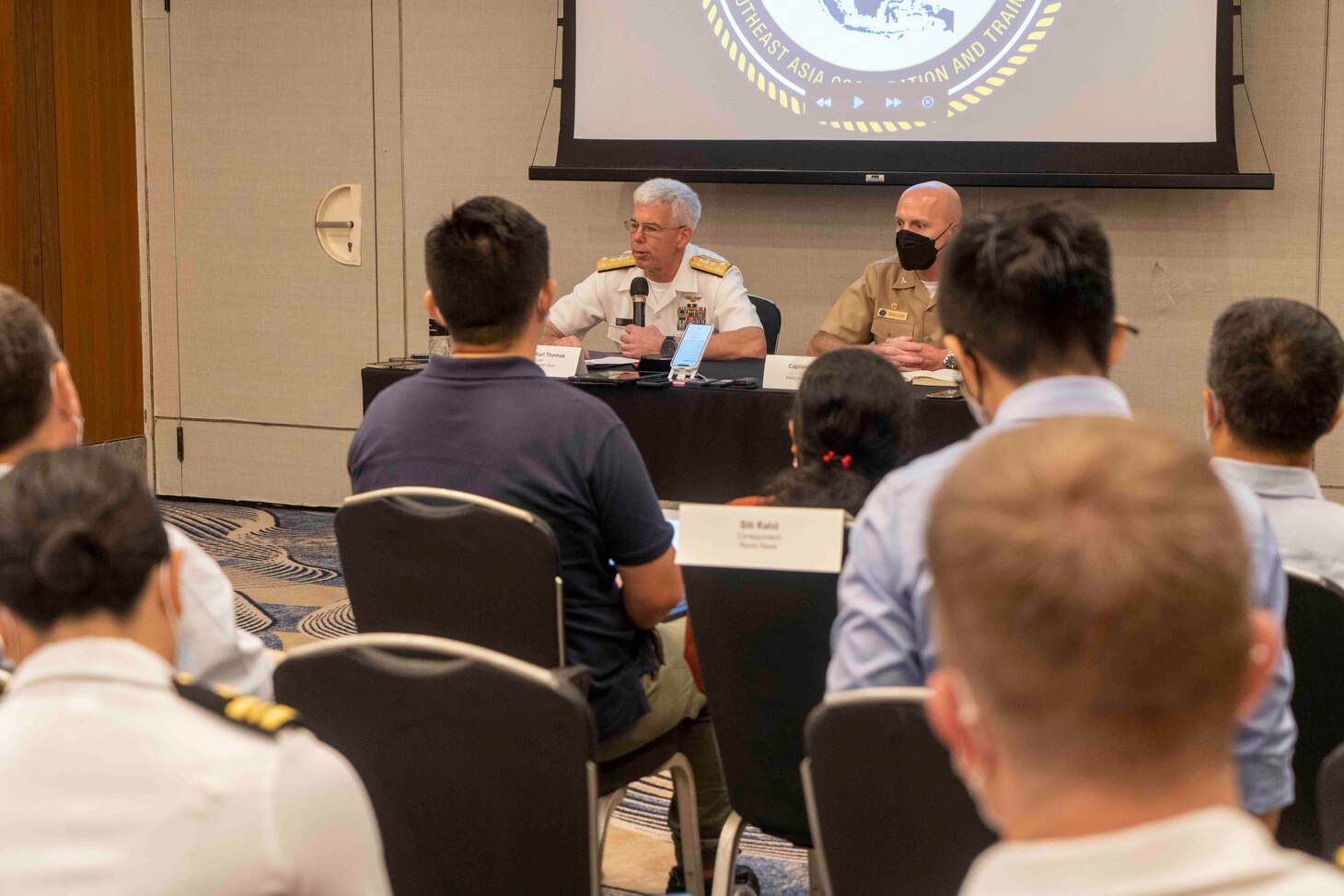 SINGAPORE (Aug. 16, 2022) – (From left) Vice Adm. Karl Thomas, commander, 7th Fleet, and Capt. Tom Ogden, commodore, Destroyer Squadron 7 (DESRON 7) answer questions during a press conference to local and international news outlets during Southeast Asia Cooperation and Training (SEACAT) Aug. 16. SEACAT is an annual multi-national exercise to strengthen cooperation and increase maritime security by the sharing of information and resources in the Southeast Asia region. (U.S. Navy Photo by Mass Communication Specialist 2nd Class Heath Zeigler)
