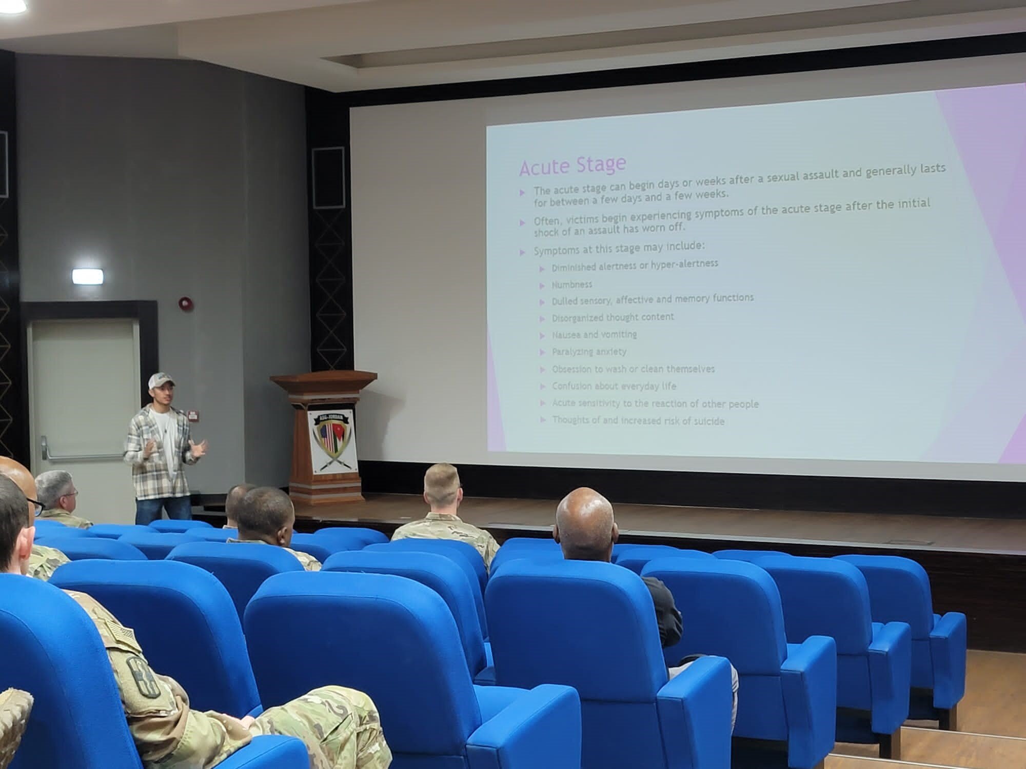 U.S. Air Force Staff Sgt. Devin Flores briefs an audience of soldiers and airmen at the Department of Defense Men's Sexual Assault Prevention and Response Campaign at an undisclosed location, July 23, 2022. The DOD Men's SAPR campaign trained and educated attendees to help male survivors of sexual assault. (Courtesy Asset)
