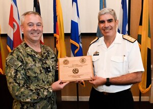 Argentine Navy Rear Adm. Marcelo Fernandez, PANAMAX 2022 Combined Force Maritime Component Commander (CFMCC) and Rear Adm. Douglas Sasse, CFMCC Deputy Commander, pose for a photo following the completion of PANAMAX 2022, Aug. 11, 2022. Exercise PANAMAX 2022 is a U.S. Southern Command-sponsored exercise that provides important training opportunities for nations to work together and build upon the capability to plan and conduct complex multinational operations. The exercise scenario involves security and stability operations to ensure free flow of commerce through the Panama Canal.