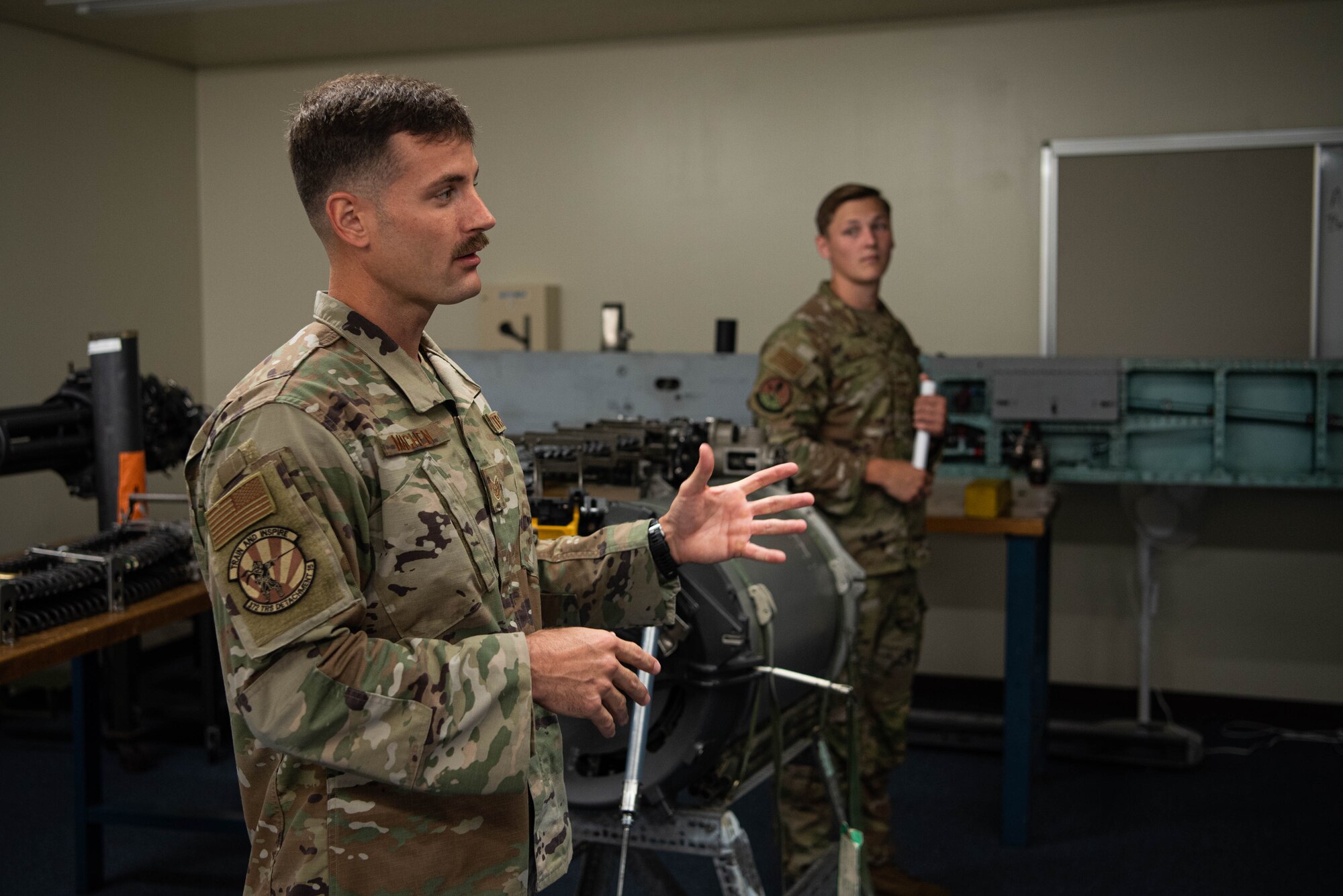 An Airman gives a presentation on weapons systems.