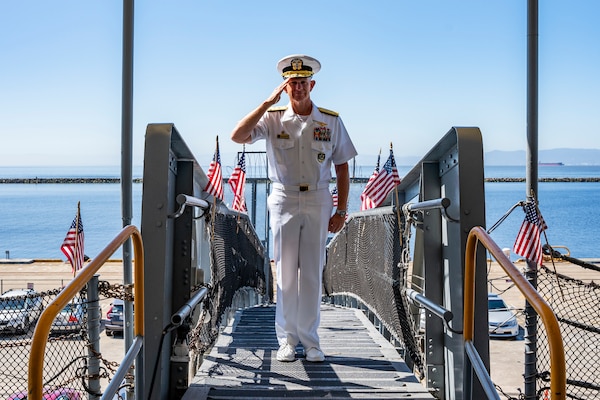 Vice Adm. Daniel Dwyer, commander, U.S. 2nd Fleet, boards the USS Hornet Sea, Air and Space Museum during the 100th Anniversary of the Aircraft Carrier ceremony in Alameda, Calif., Aug. 13.