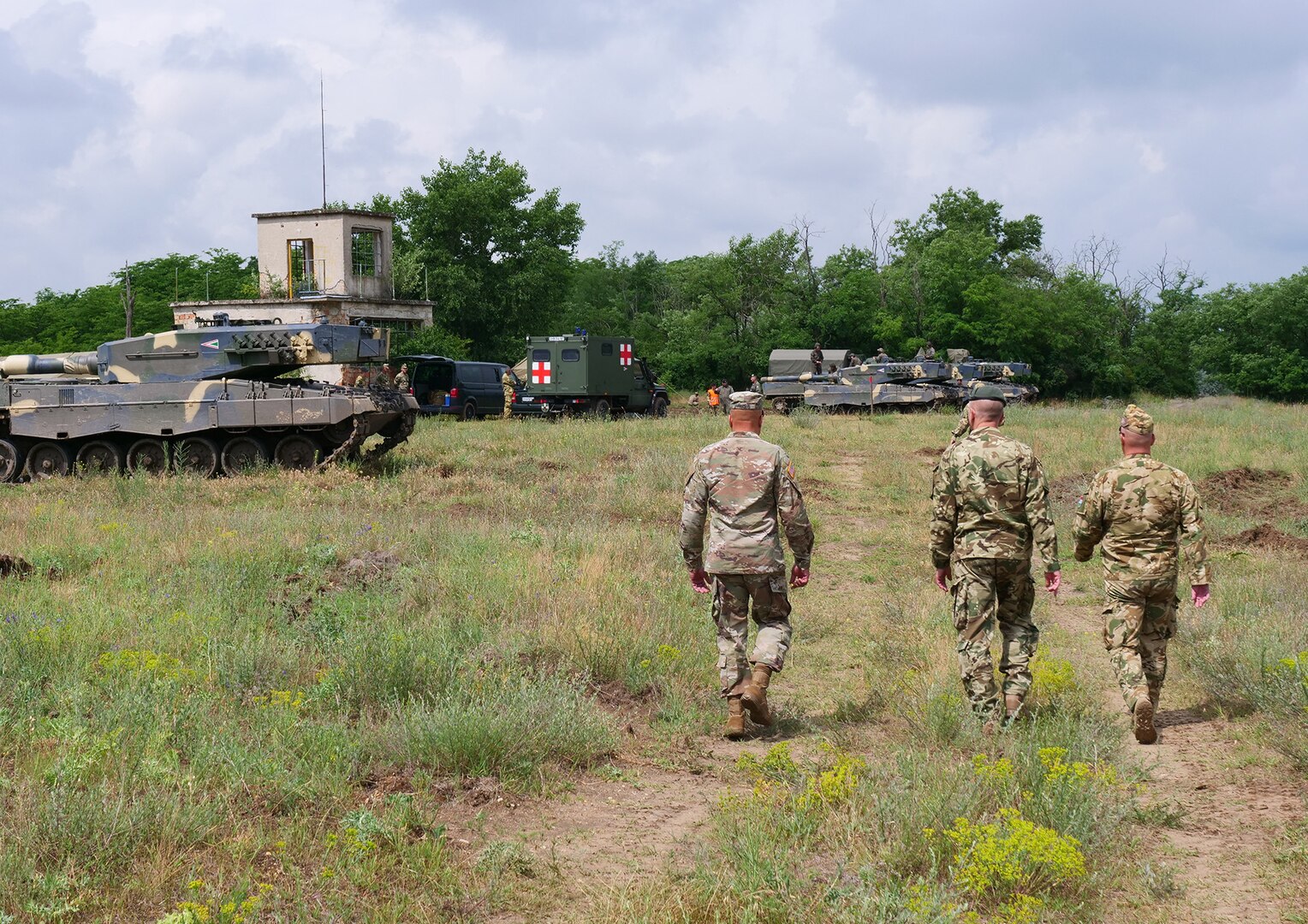 Maj. Gen. John C. Harris Jr. (left), Ohio adjutant general, visits a military vehicle driving range with a delegation from the Hungarian Defence Forces during an infantry brigade presentation and showcase event June 9, 2022, in Tata, Hungary.