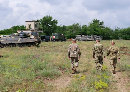 Maj. Gen. John C. Harris Jr. (left), Ohio adjutant general, visits a military vehicle driving range with a delegation from the Hungarian Defence Forces during an infantry brigade presentation and showcase event June 9, 2022, in Tata, Hungary.