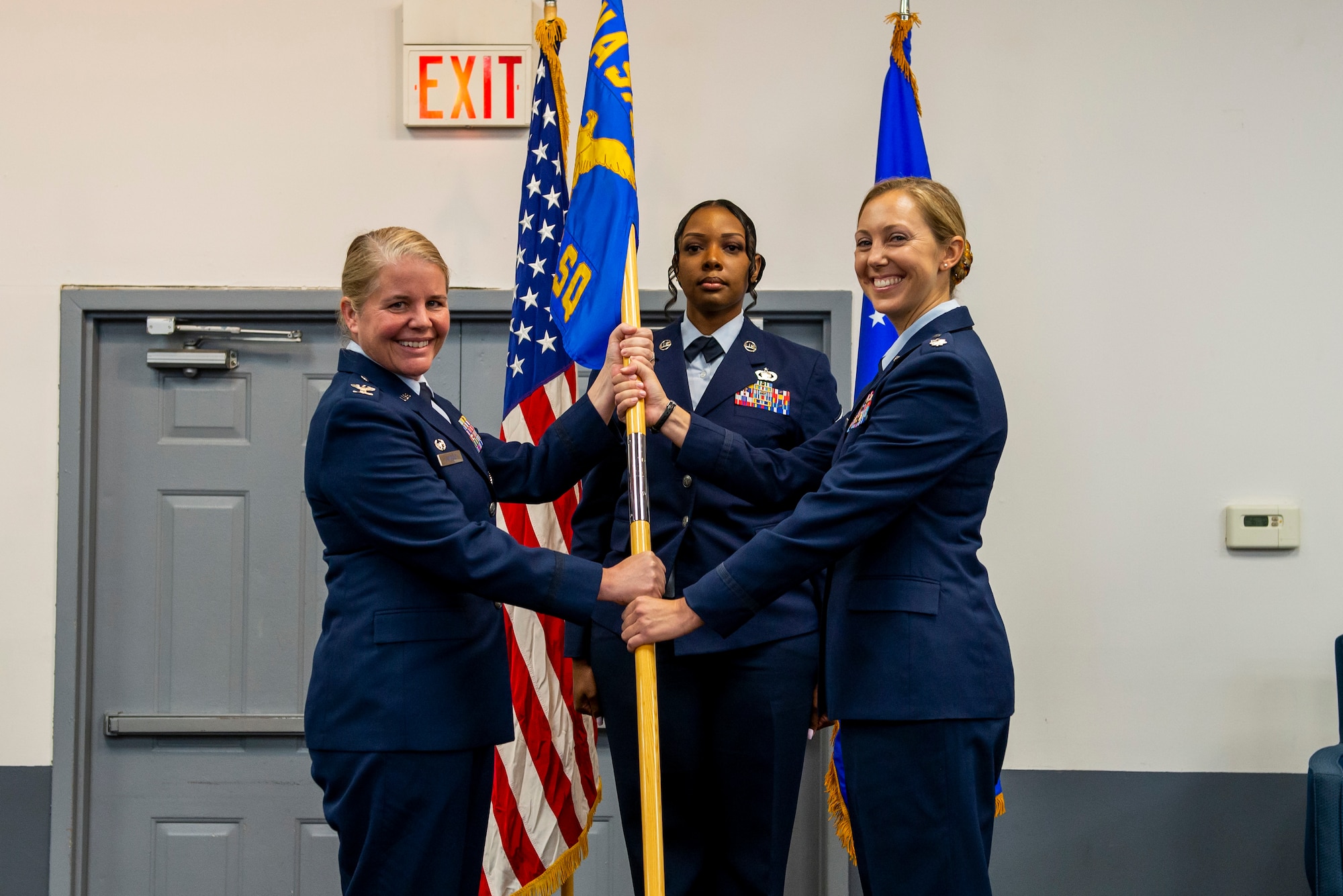 Lt. Col. Hayley Hartstein Integrated Command, Control, Computers, Communications, Intelligence, Surveillance, and Reconnaissance Analysis Squadron commander accepts the ceremonial guidon from Col. Catherine Gambold, Air and Cyberspace Intelligence Group commander, in an Aug. 4, 2022 ceremony in Dayton, Ohio. Hartstein previously served as an exchange officer, working as the director of the Spanish Air Force Academy language section in San Javier, Spain