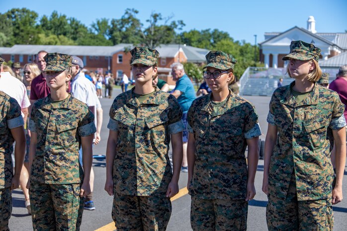 U.S. Marines officers stand at attention during their swearing-in ceremony at the Officer Candidate School at Marine Corps Base Quantico, Va. on August 13, 2022. These officers are part of the Platoon Leaders Course Law Program and will become Judge Advocates it is a rare occasion of four women pursuing this career in the Marine Corps. (U.S. Marine Corps photo by Lance Cpl. Gustavo Romero)