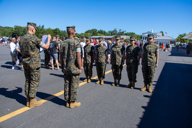 U.S. Marines officers stand at attention during their swearing-in ceremony at the Officer Candidate School at Marine Corps Base Quantico, Va. on August 13, 2022. Four of These officers are part of the Platoon Leaders Course Law Program and will become Judge Advocates it is a rare occasion of 4FOUR women pursuing this career in the Marine Corps. (U.S. Marine Corps photo by Lance Cpl. Gustavo Romero)