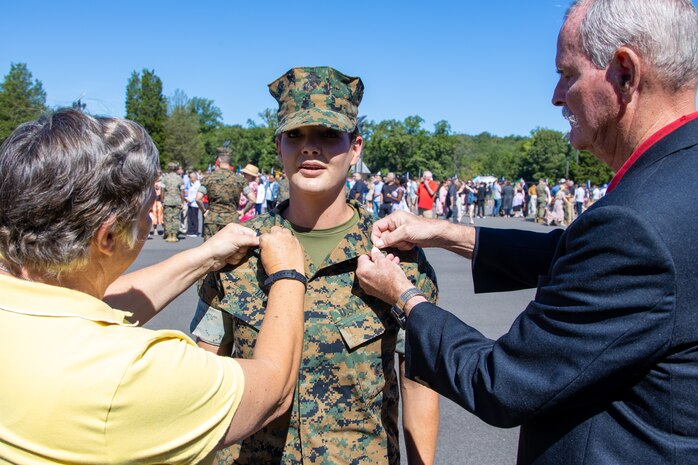U.S. Marines Corps 2nd Lt. Cameron C. Tate, a native of Carrizozo, New Mexico, has her ranked pinned on by her parents during a swearing-in ceremony at the Officer Candidate School, Marine Corps Base Quantico, Va. on August 13, 2022. These officers are part of the Platoon Leaders Course Law Program and will become Judge Advocates it is a rare occasion of four women pursuing this career in the Marine Corps. (U.S. Marine Corps photo by Lance Cpl. Gustavo Romero)