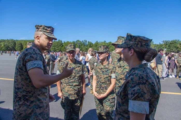 U.S. Marines Corps Capt. Jhonathan Morales Najera, deputy staff judge advocate and law programs manager, with Marine Corps Recruiting Command, congratulates newly commissioned Marine officers during a swearing-in ceremony at the Officer Candidate School, Marine Corps Base Quantico, Va. on August 13, 2022. These officers are part of the Platoon Leaders Course Law Program and will become Judge Advocates it is a rare occasion of four women pursuing this career in the Marine Corps. (U.S. Marine Corps photo by Lance Cpl. Gustavo Romero)