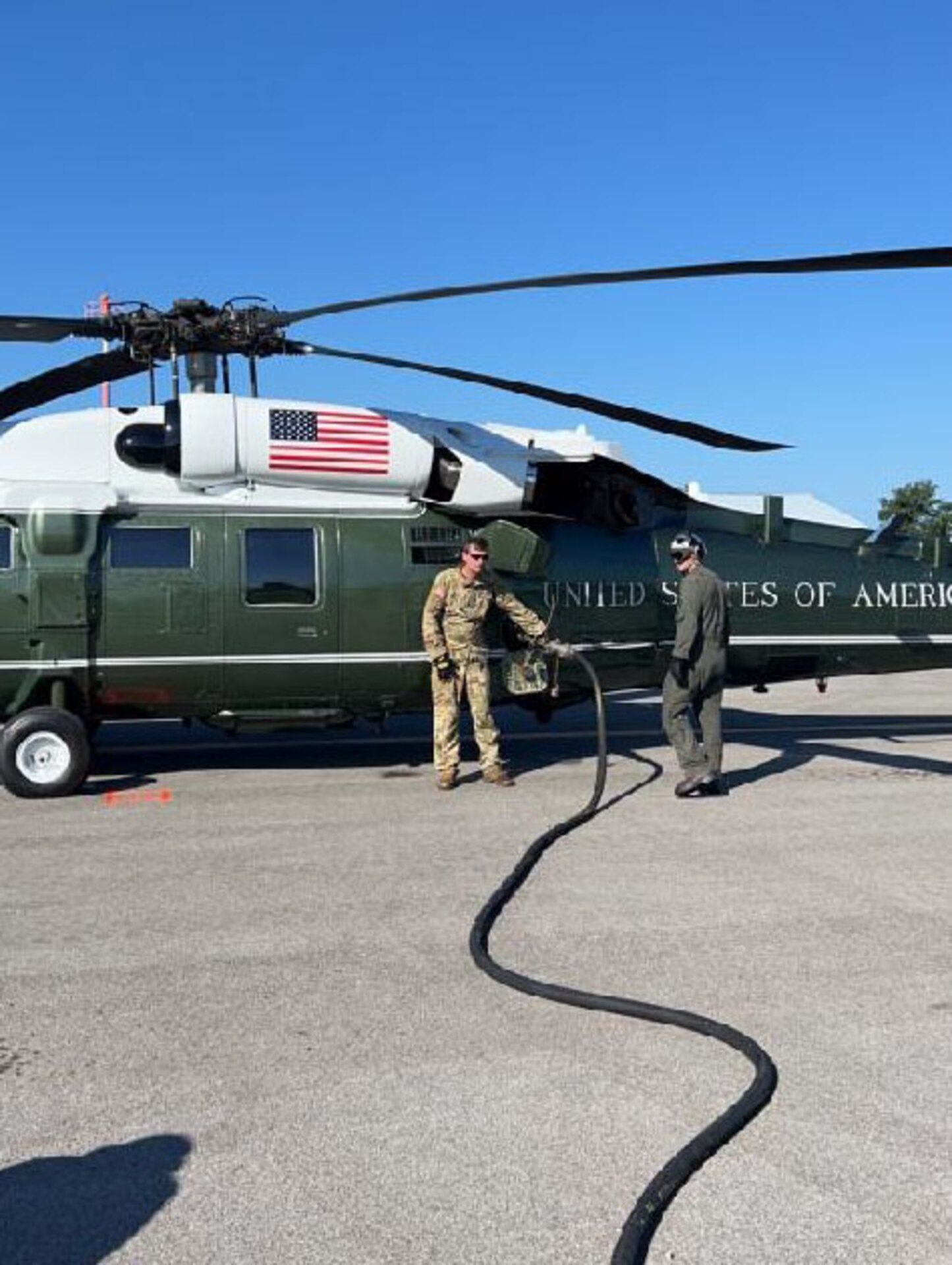 Army Sgt. William ‘Cecil’ Harris, a fuel Supply specialist with Detachment 1, Carlie Co. 2-238th Aviation- ‘Wildcat DUSTOFF’ refuels the presidents Sikorsky VH-60 helicopter, Marine One, while it sits on the ground in Hazard, Ky., Aug 7, 2022