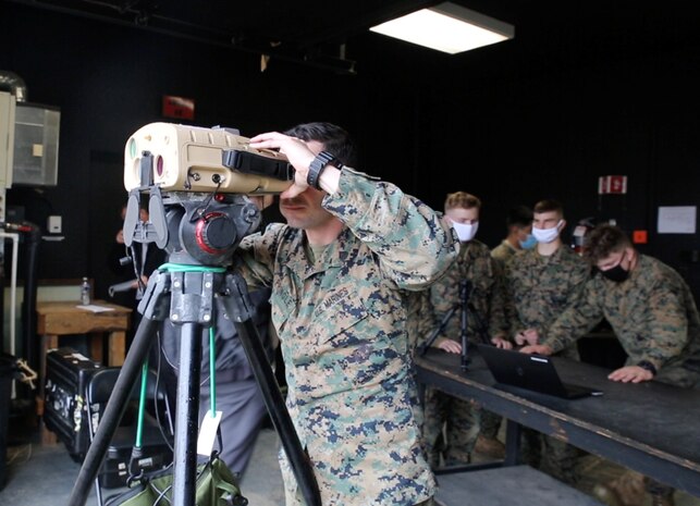 Marine peers through a prototype version of the Next-Generation Handheld Targeting System, March 2021 at U.S. Army Garrison Fort A.P. Hill, Virginia. The Next-Generation Handheld Targeting System, or NGHTS, is an innovative, man-portable targeting system allowing Marines to rapidly and accurately conduct target location and laser guidance during combat operations.
