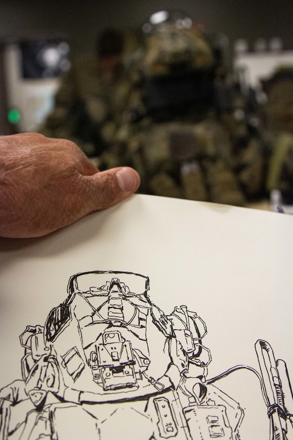 Capt. Charles Bauman, a combat artist and logistics officer with Marine Wing Support Squadron 271, illustrates a Marine Raider’s kit during a pre-deployment culminating exercise at Camp Lejeune, N.C., June 13-16, 2022. Combat artist is a free military occupational specialty that can be filled by any Marine regardless of primary military occupational specialty in addition to their regular duties. They illustrate military operations on behalf the Marine Corps’ historical collection efforts. (U.S. Marine Corps photo by Capt. Michael Reynolds)