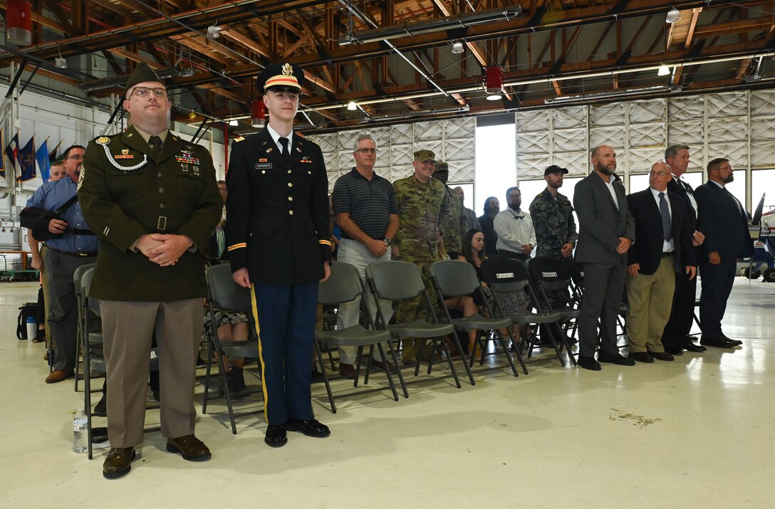 Members transferring from the 53rd Signal Battalion to the 53rd Space Operations Squadron stand to be recognized during the U.S. Army satellite communications mission transfer ceremony at Peterson Space Force Base, Colorado, Aug. 15, 2022. Along with the SATCOM mission, approximately 200 civilian and 300 military billets transferred from the Department of the Army to the Department of the Air Force. (U.S. Space Force photo by Airman 1st Class Kaitlin Castillo)
