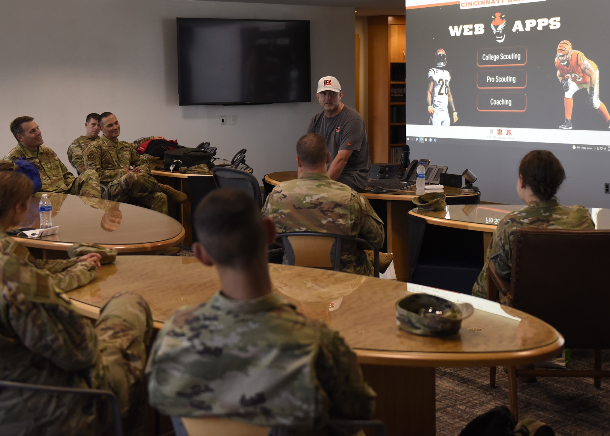 Duke Tobin (top center), Cincinnati Bengals Director of Player Personnel, briefs 70th Intelligence, Surveillance, & Reconnaissance Wing senior leaders during a Senior Leadership Summit Aug. 8, 2022, at Wright-Patterson Air Force Base, Ohio. Tobin discussed how an organization like the Cincinnati Bengals builds a successful team by using analytics on performance and character traits to choose the right players.